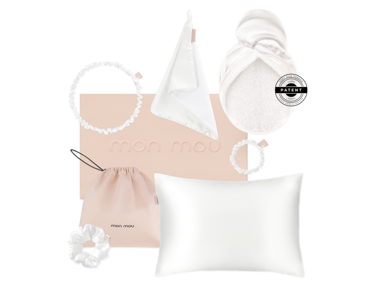 Mon Mou pastel nursery set: blush pink pillow, hooded towel, drawstring bag, fabric rings, and hair scrunchies on white background
