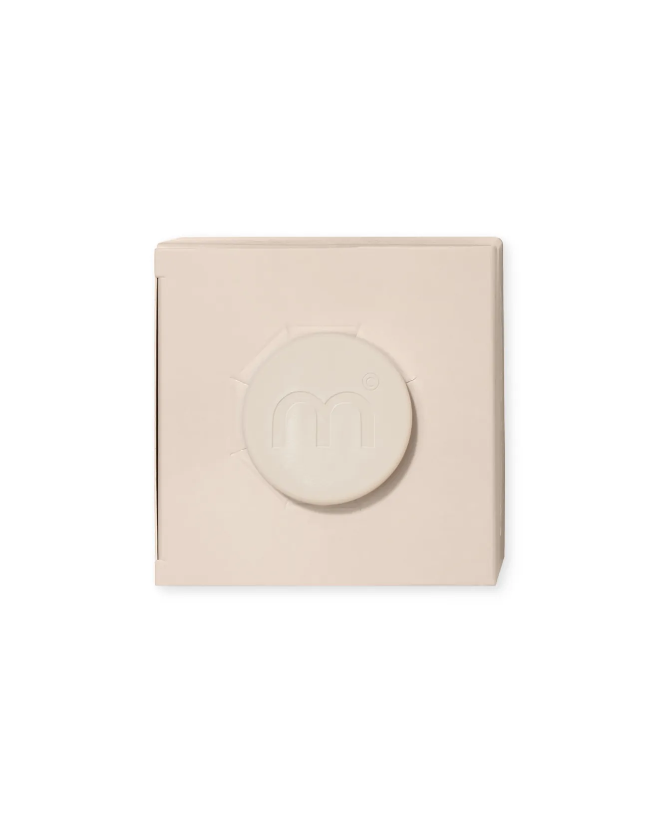 Beige wall plate with a round central dial or knob in the middle.