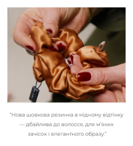 Close-up of hands holding a copper satin hair scrunchie relevant to a hair accessory showcase.