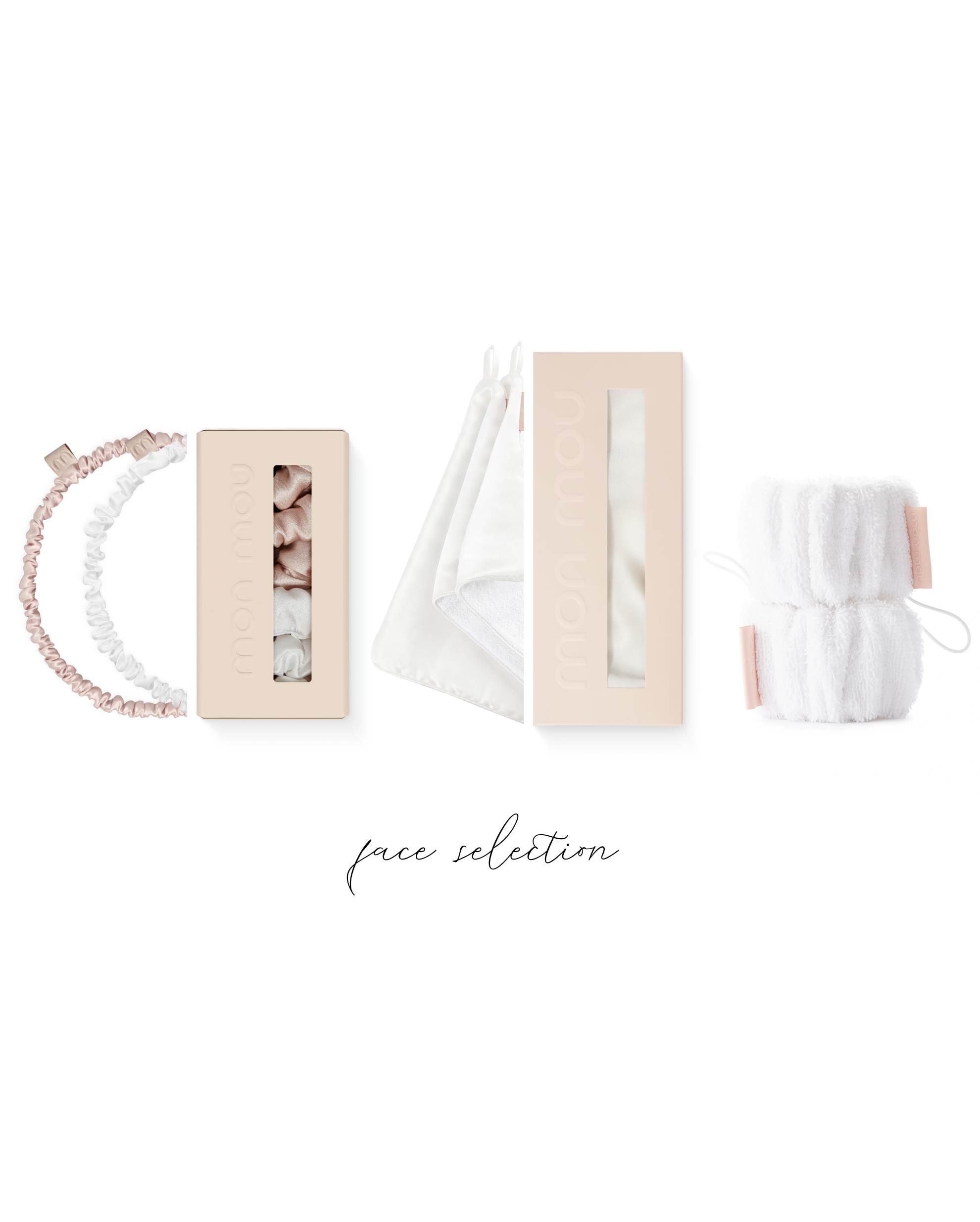 Flat lay of pale pink cosmetic boxes, white fabric bags, hair ties, and a fluffy white towel along the bottom edge on a white background (text 'face selection' at bottom).