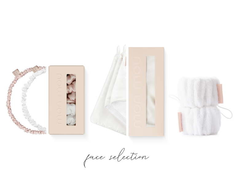 Flat lay of blush pink beauty boxes, fabric headbands, ribbons, towel, and spa accessories arranged in a row against a white background, soft and elegant.