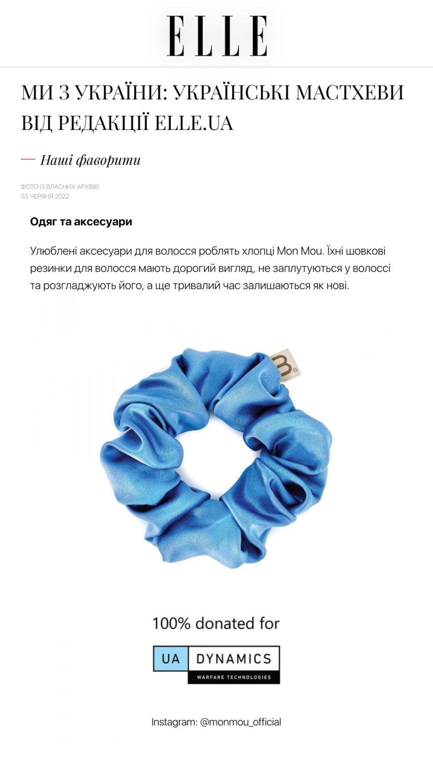 Blue satin scrunchie with a dollar bill peeking out, part of a donation graphic reading '100% donated for UA DYNAMICS'
