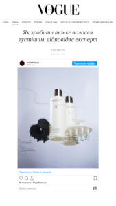 Two Revitalash cosmetic bottles (hair care) on a reflective surface with a splash of water, product-focused image promoting hair thickening.